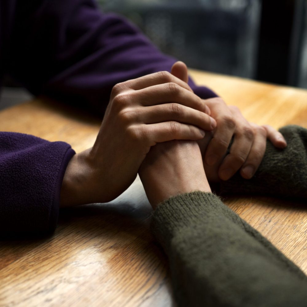 hands-holding-each-other-support